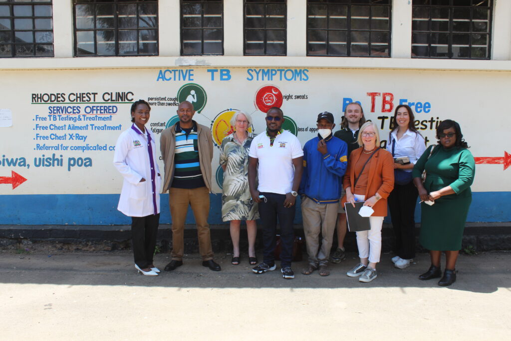 A delegation from Results UK stand outside a chest clinic in Kenya. 