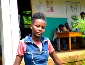 Zinagh, a student from Halaba, Ethiopia, stands looking at the camera. 