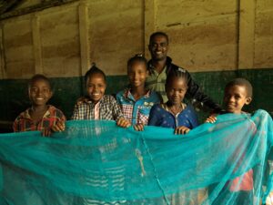 School teacher, Belay, facilitates a malaria club passing on valuable knowledge on sleeping under a mosquito net, Himbecho, Ethiopia © Malaria Consortium